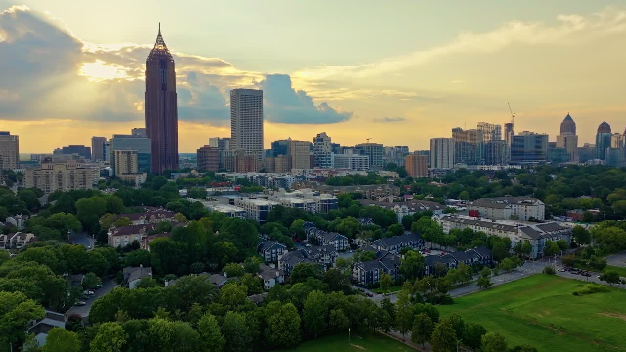 Atlanta skyscraper Bank of America Plaza view from Central Park, Midtown Atlanta condominium complex, apartments surrounded by greenery, urban parks at sunset, Peachtree Street, Georgia, Aerial