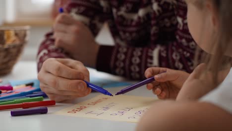 Little-girl-writing-letter-to-Santa-Claus