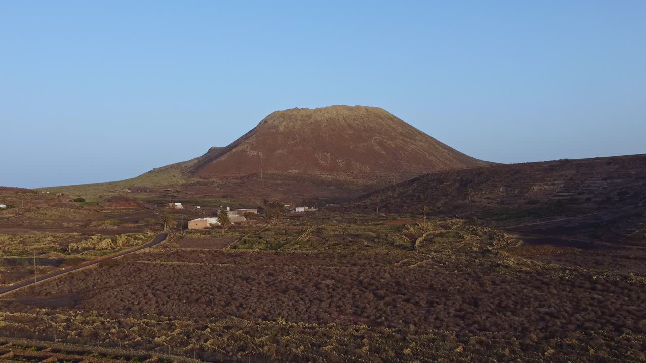 Rough Landscape At  Ye Village And Volcan de La Corona On The Canary Island Of Lanzarote In Spain. aerial