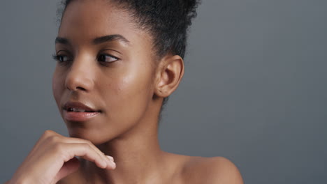 close-up-portrait-beautiful-african-american-woman-gently-touching-face-with-hands-enjoying-smooth-healthy-skin-complexion-natural-feminine-beauty-skincare-concept