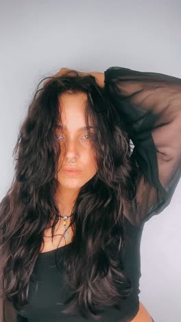 woman portrait with long dark hair and accessories