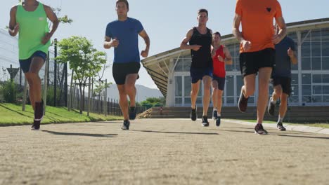 men running outside on sunny day