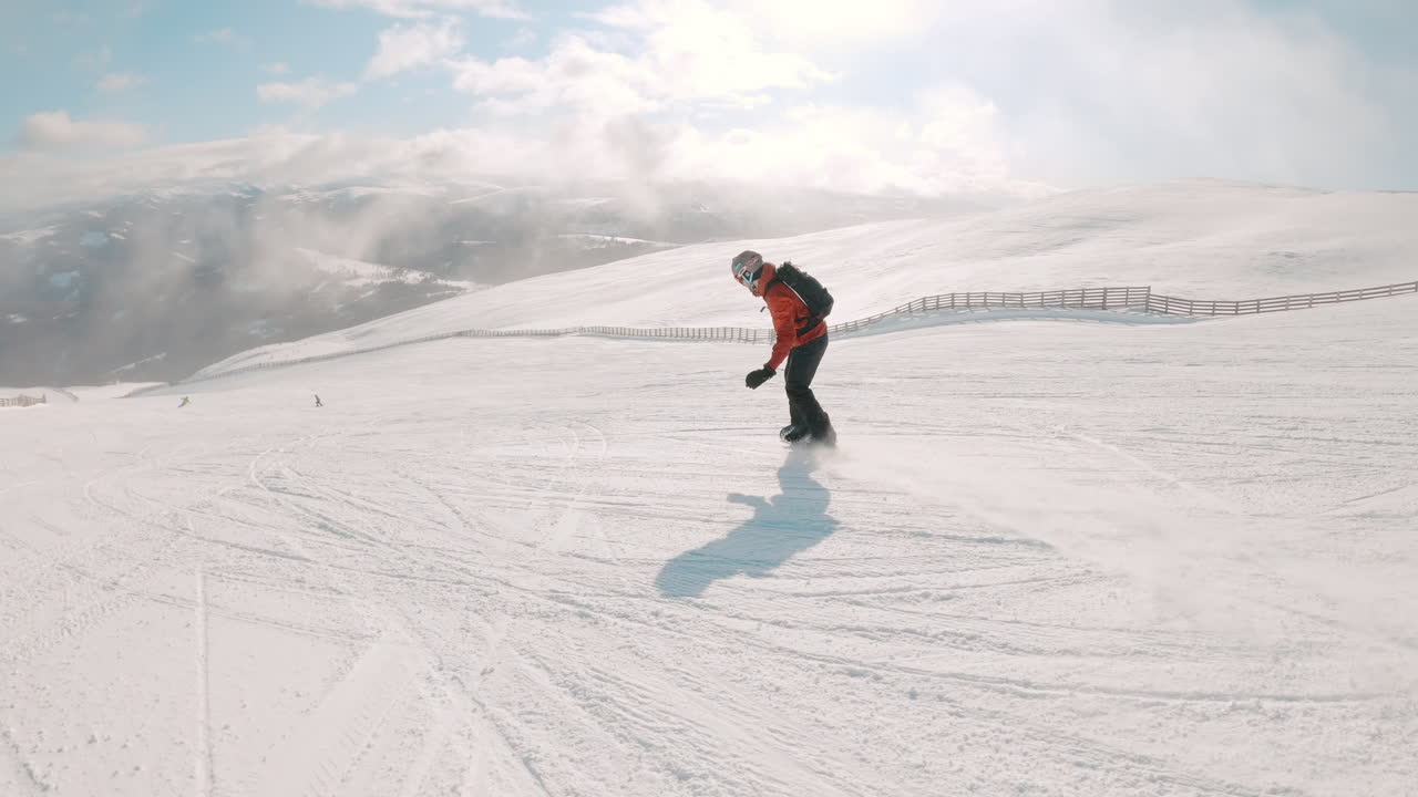 Snowboarders on a Snowy Mountain Slope