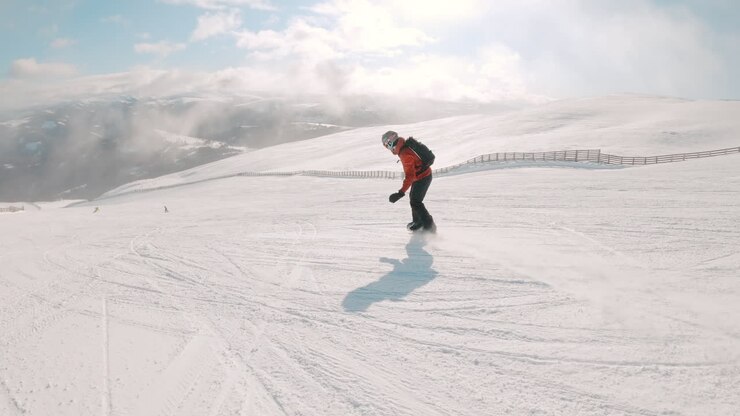 Snowboarders on a Snowy Mountain Slope