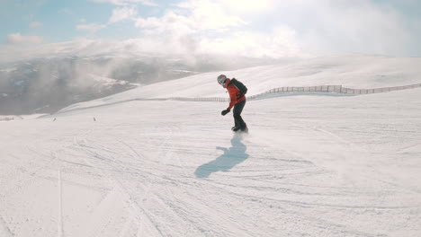 snowboarders on a snowy mountain slope