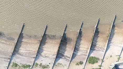 Groins-on-beach-West-Mersea-Essex-UK-Overhead-birds-eye-drone-aerial-view