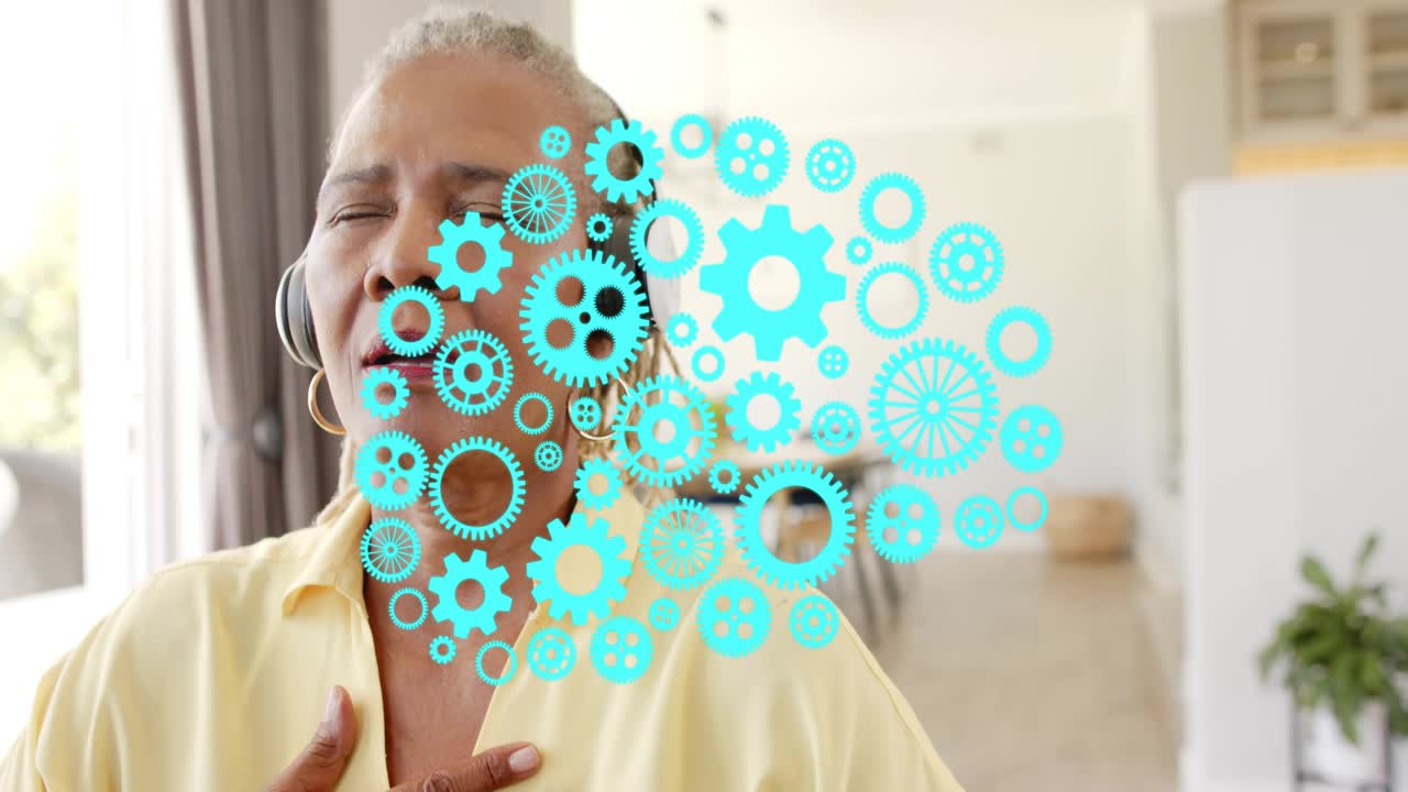 Senior woman placing hand on chest hearing guide via headphones, teal gears showing breath health