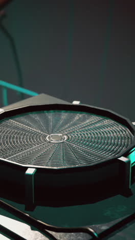 intricate design of futuristic tech in a dimly lit workshop setting