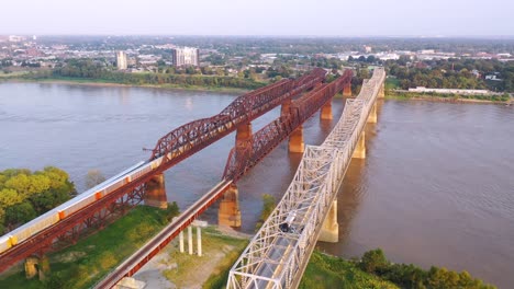 aerial of landmark three steel bridges over the mississippi river with memphis tennessee background 2