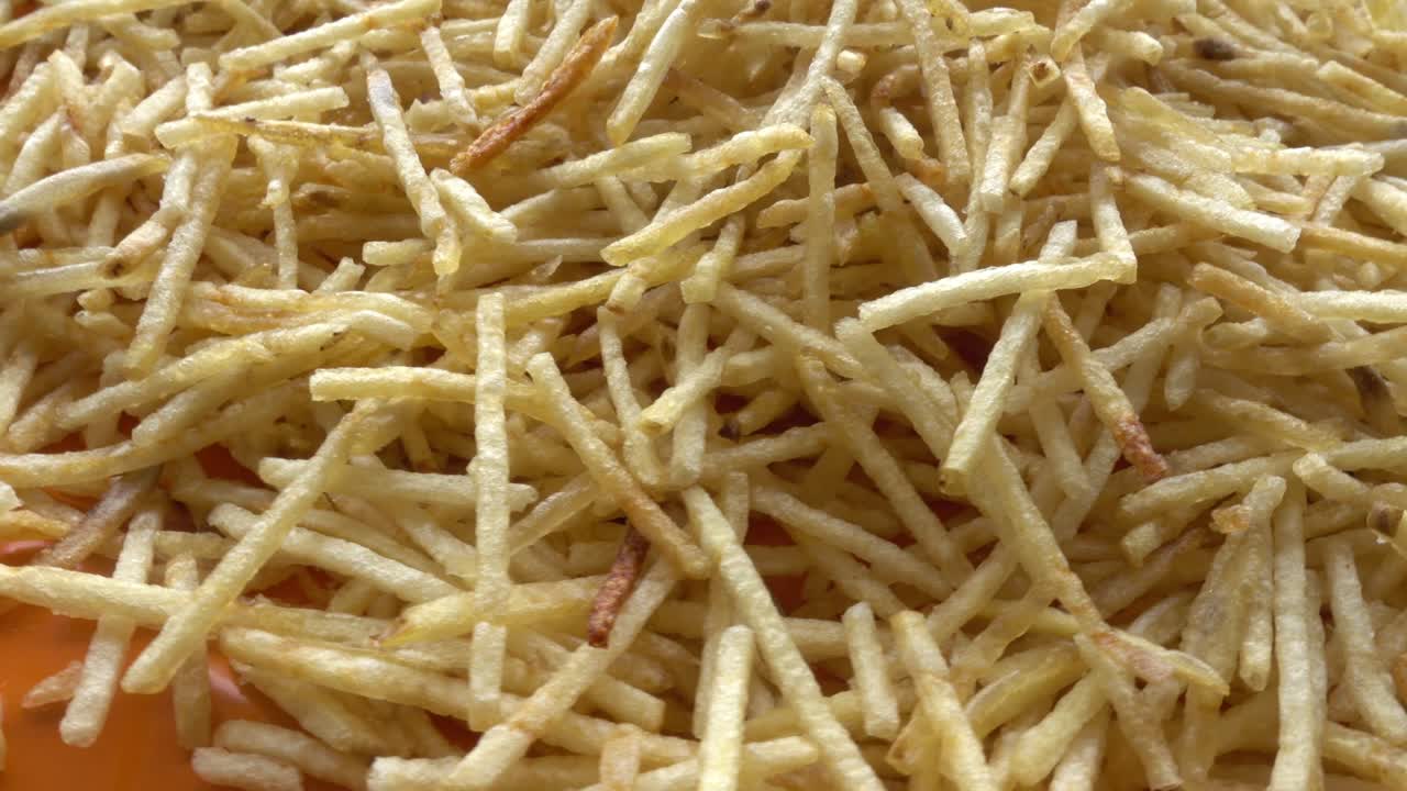 French Fries Rotates in a Circle, Fast Food Concept, Close Up