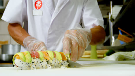 male chef preparing sushi in kitchen 4k