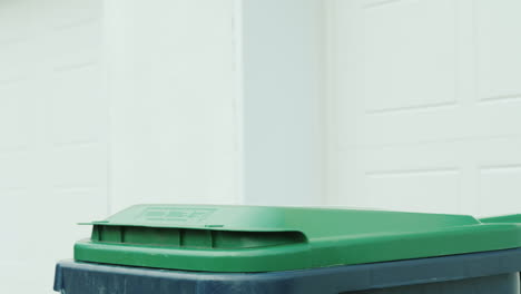 homeowner dumps household rubbish in a container near house 02