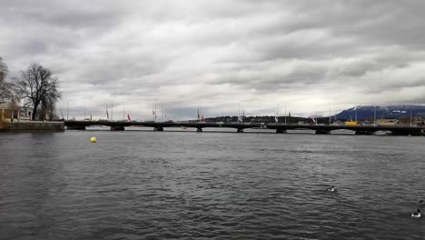 A-moody-sky-adorns-this-shot-of-Lake-Geneva-and-the-Mont-Blanc-bridge-in-Geneva-Switzerland