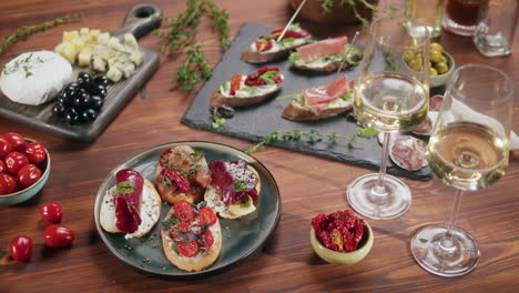 appetizing bruschetta and charcuterie board with wine