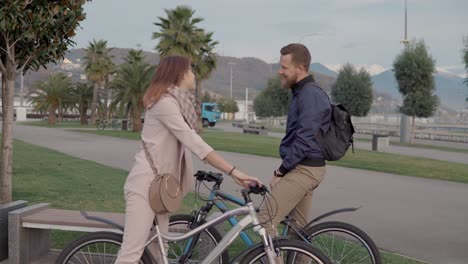 couple on bikes in the park