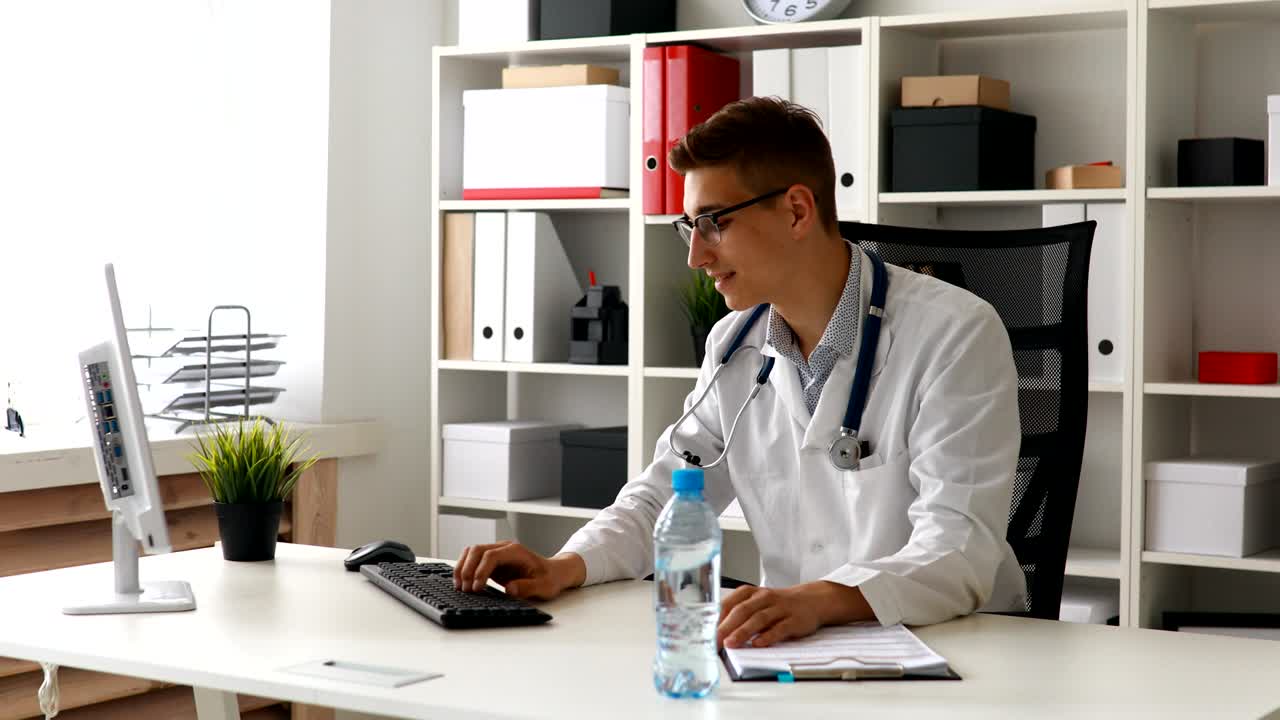 Doctor put bottle of water on table