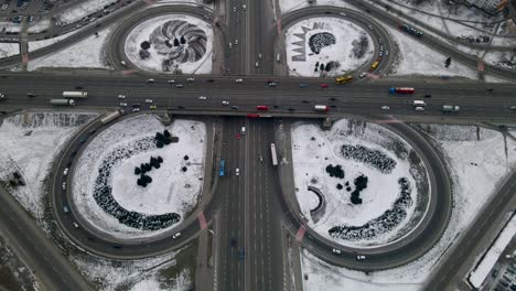 aerial drone view of road junction, large car interchange. aerial highway junction at winter evening, colorcorrected 4k footage