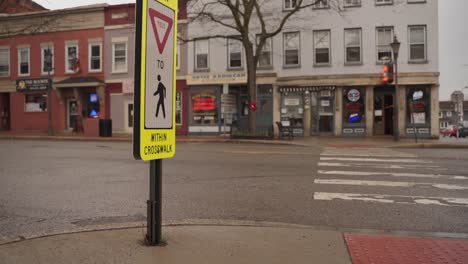 an empty crosswalk in the town of brockport, new york after the corona virus warnings - wide shot