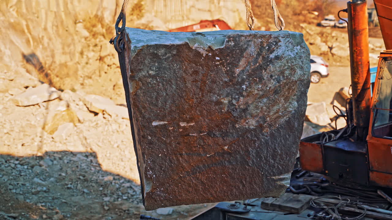 Machinery in quarry of marble extraction. Close up view of crane at work in quarry of marble blocks