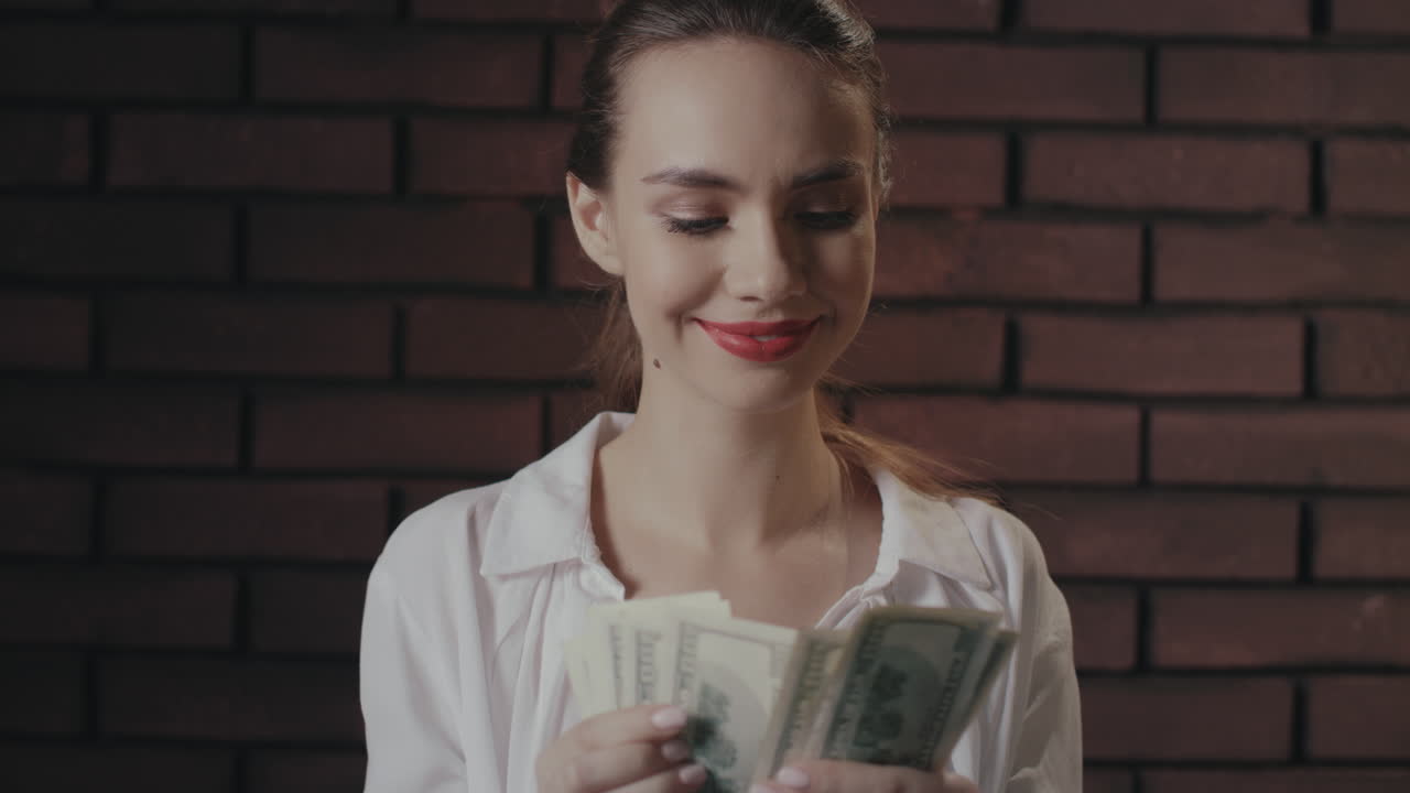 Happy woman counting money