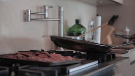 beef meat cocking grill in home kitchen black chef preparing meal