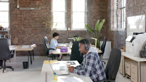 focused diverse colleagues having video call in office in slow motion