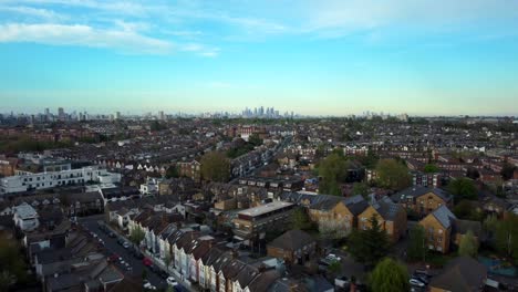 fast drone shot flying backwards over south london residential suburb