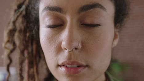 close-up-portrait-of-beautiful-mixed-race-woman-face-looking-serious-pensive-at-camera-independent-woman-focused-intense