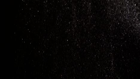 the beautiful falling of shimmering particles. slow motion