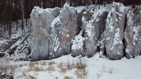 snowy rock formations in a winter forest