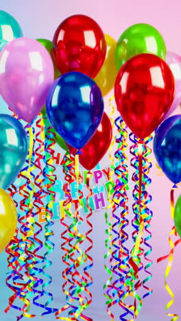 colorful birthday balloons and ribbons