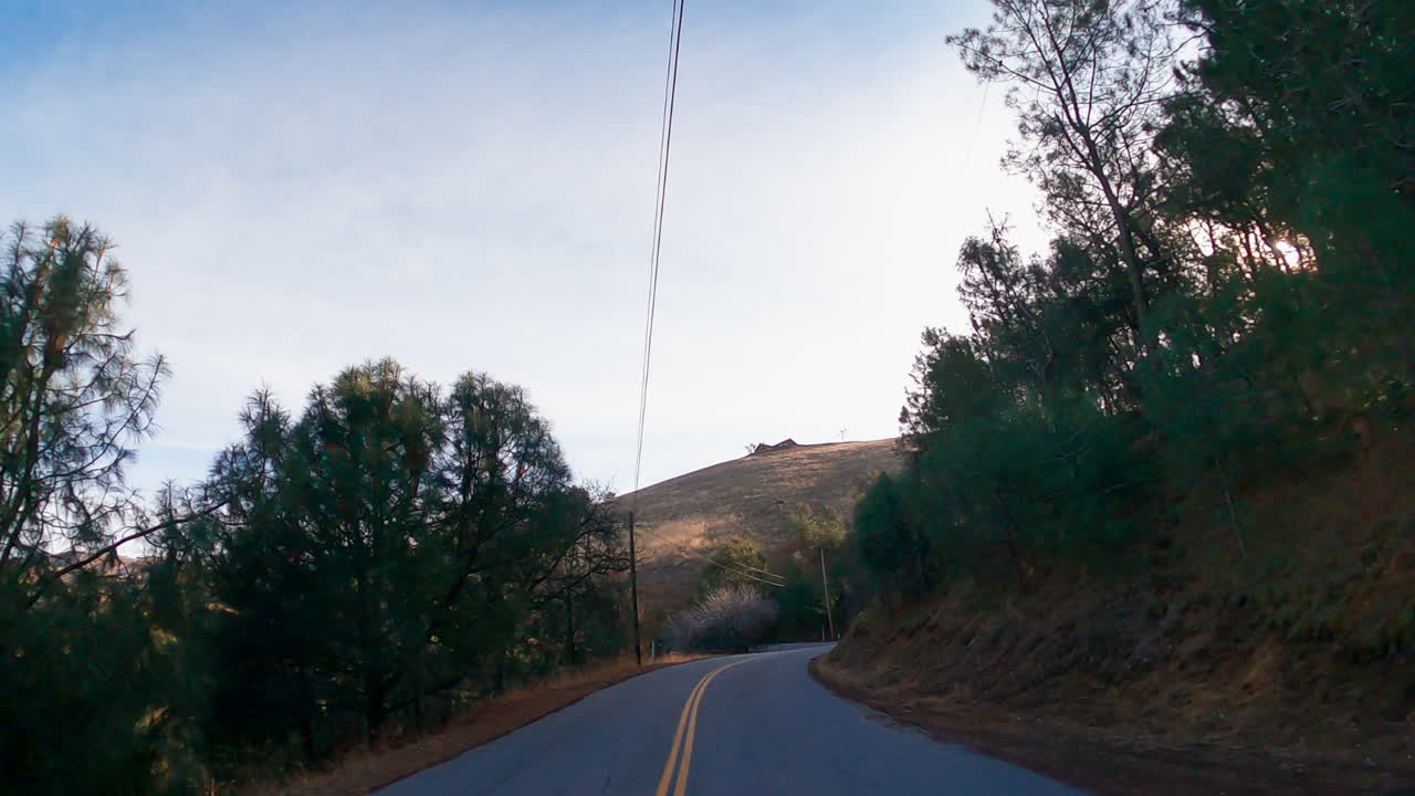 Driving along a country road through the Tehachapi Mountain Range - point of view
