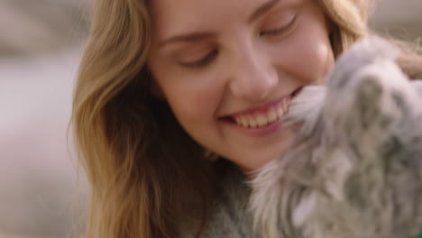 close up beautiful woman smiling playing with dog in park enjoying petting fluffy companion having fun relaxing on grass caressing puppy