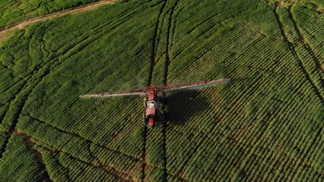 tractor spraying soybean plantation in brazil