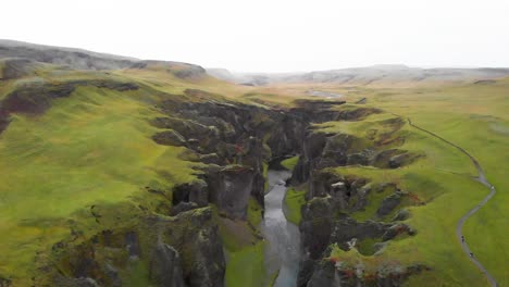 rugged and jagged rock walls of fjadrargljufur canyon river stream