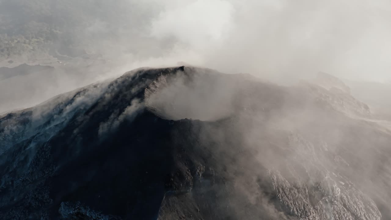 Aerial view of dense ash plume over Fuego volcano crater in Guatemala