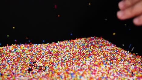 vibrant sprinkles cascade onto a surface