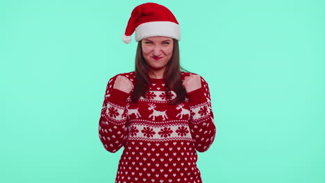 Cheerful-girl-in-red-sweater-Christmas-Santa-shouting,-celebrating-success,-winning,-goal-achievemen