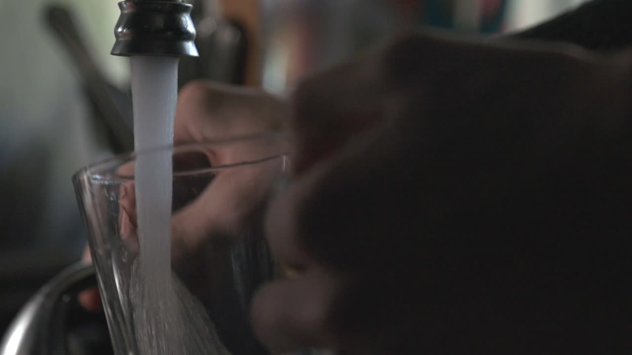 Filling A Glass Mug With Tap Water - close up slowmo