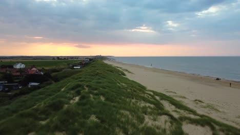 Aerial-flying-over-sand-and-dunes-on-Eccles-Beach-in-Norfolk,-England