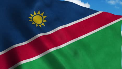 namibia flag on a flagpole waving in the wind, blue sky background. 4k