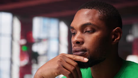 vertical video african american guy thinking about new ideas to increase clients numbers