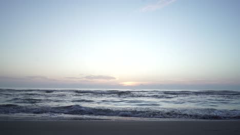 Gazing-at-sunrise,-I-absorb-the-ocean-waves-in-Cancun's-Playacar,-Mexico,-through-my-own-eyes