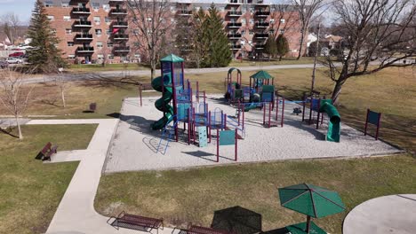 Drone-shot-of-empty-playground-and-splash-pad-in-public-park