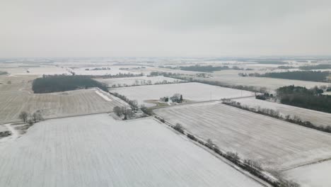 drone flying away from rural farmland in midwestern america