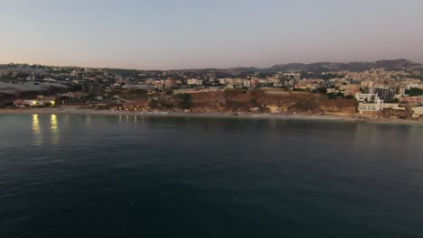 Light-fades-over-Batroun-City,-Lebanon-and-the-Mediterranean-Sea