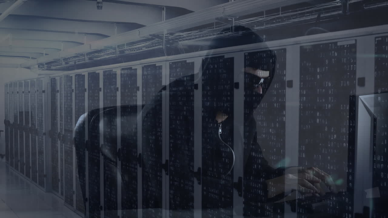 Animation of hooded man hacking computer