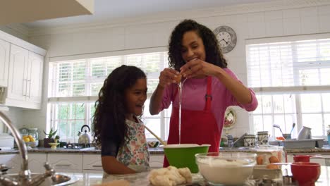 family making christmas cookies at home