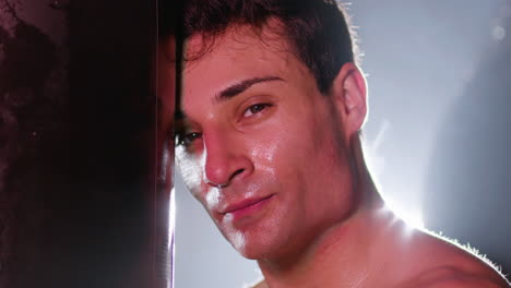 portrait shot of young male athlete catching breath