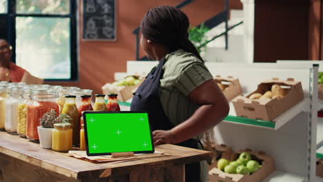 tablet display showing greenscreen in local organic shop